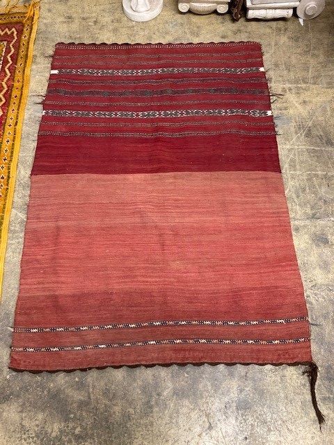 Two Kelim rugs and a geometric wool rug, largest 240 x 140cm